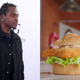 Pusha T admires his benefactor, a lump of deep-fried fish stuck between pieces of bread.